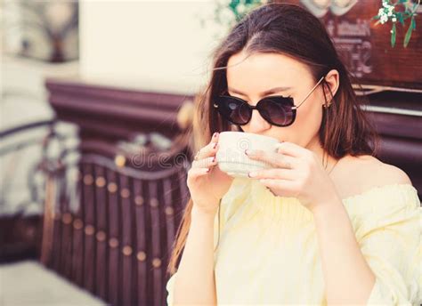 Woman In Sunglasses Drink Coffee Outdoors Girl Relax In Cafe Cappuccino Cup Caffeine Dose