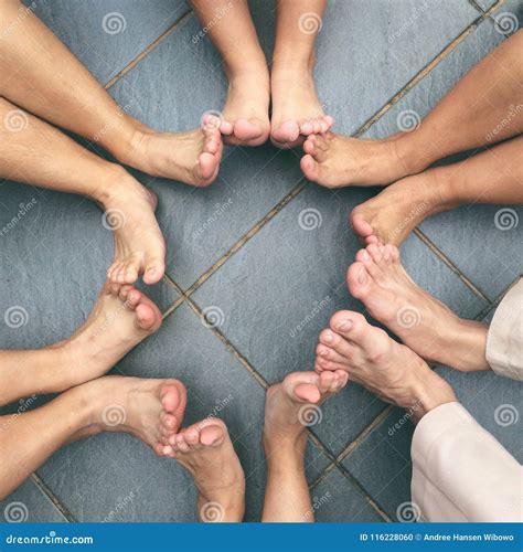 People Sitting In A Circle With Feet Touching Stock Photo Image Of