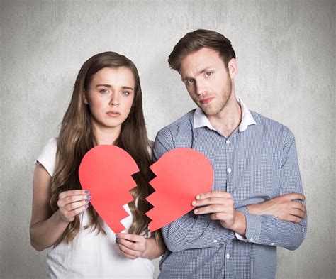 Premium Photo Couple Holding Broken Heart Against Weathered Surface