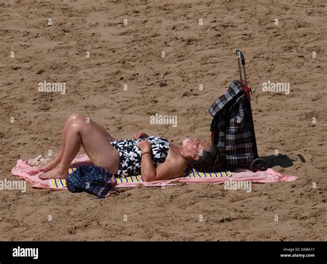 Old Woman Sunbathing On Beach Hi Res Stock Photography And Images Alamy