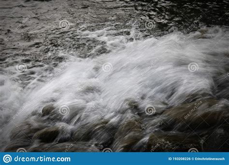 Different Speeds Of Rushing Water Shown Simultaneously Stock Photo