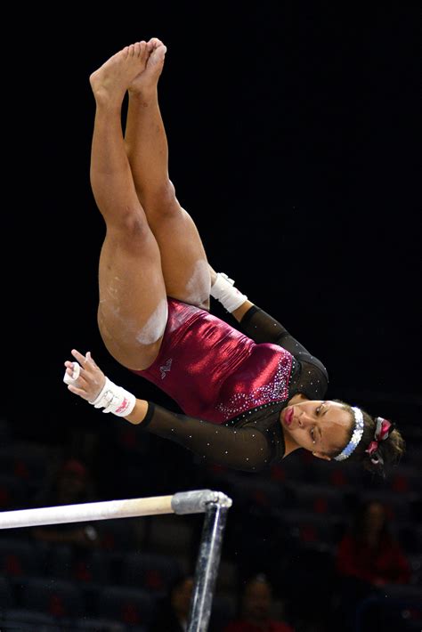 University Of Denver Gymnast Nina Mcgee Competes A Gienger On Bars