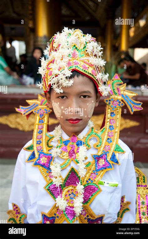 Portrait Of A Burmese Boy Dressed In Traditional Costume Wearing Face