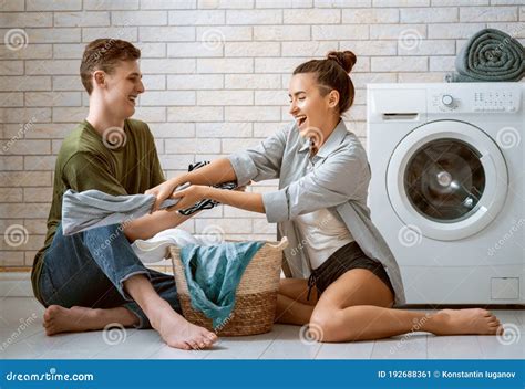 Loving Couple Is Doing Laundry Stock Image Image Of Happy Hold