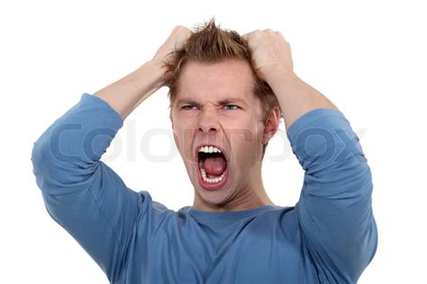 Man Screaming And Pulling His Hair Stock Photo Colourbox