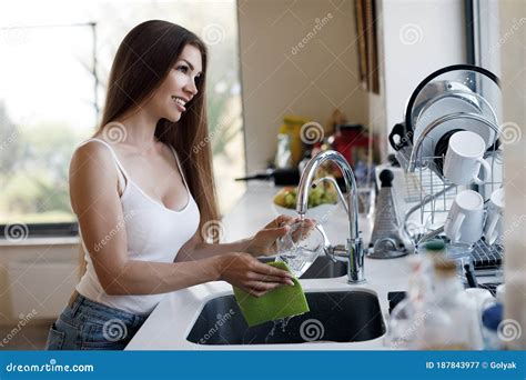 Beautiful Woman Doing Cleaning At Home And Wash Dishes Stock Image