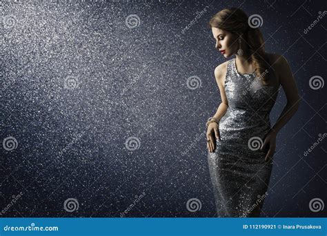 Silver Dress Fashion Model Posing In Sparkling Gown Stock Image