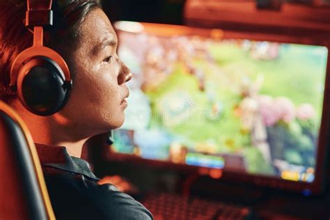 Close Up Shot Of A Focused Asian Guy Professional Cybersport Gamer
