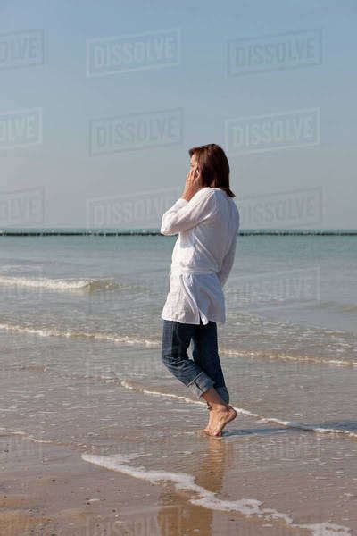 Woman On Beach Stock Photo Dissolve