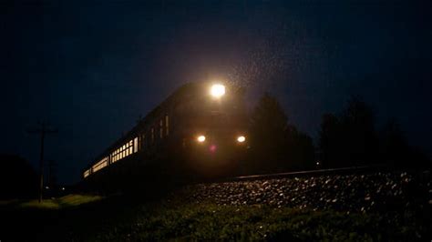 Train Passing Fast Through A Rural Area By Night Stock Footage Videohive