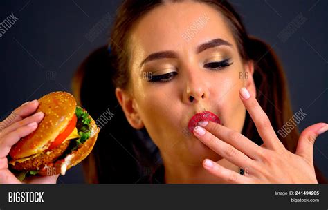 Woman Eating Hamburger Image And Photo Free Trial Bigstock