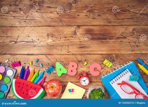 Back To School Background With School Supplies On Blackboard Top View