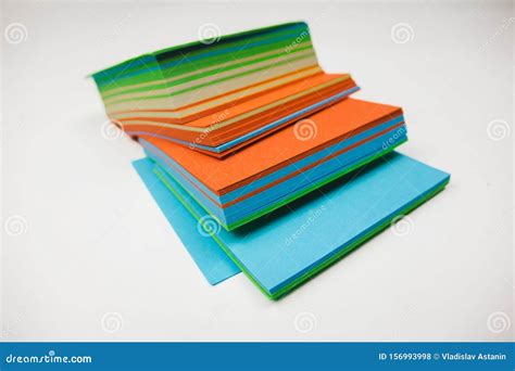 A Stack Of Multicolored Note Papers On An Isolated White Background