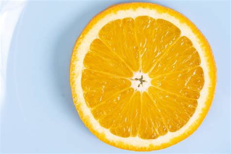 Flat Lay Above Sliced Orange Fruit On The Blue Plate Creative Commons
