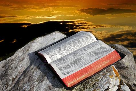 Holy Bible And Skies Open Old Bible On A Rock On A Beautiful Sky At