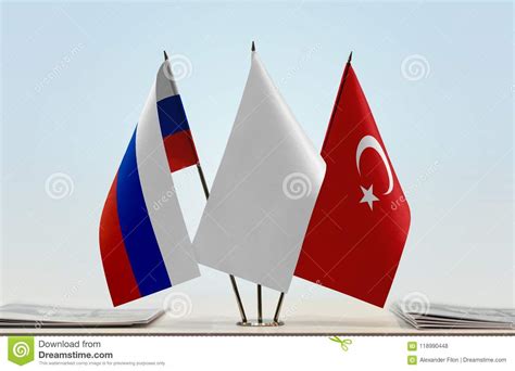 The turkish flag comprises of a red background on which there is the motif of the crescent moon and a star. Flaggor Av Ryssland Och Turkiet Arkivfoto - Bild av ...