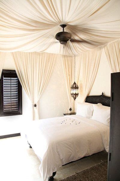 It has the structure of a canopy bed, but install a ceiling fan in the center of the room or in the center of the space above your canopy bed, ensuring that all ceiling fabrics are attached to the ceiling. Cabo azul resort | Canopy bedroom, Diy canopy, Fabric ceiling