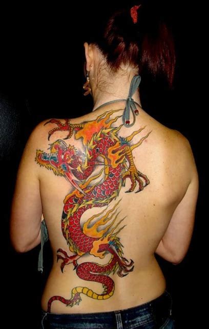 Tattoo with the image of a burning torch is often used by people living in places of detention. Picture Of Red dragon and flame tattoo on the back