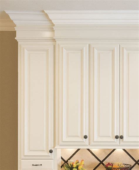 I cut straight 1x3s and placed them every few feet on top of the cabinets. How to Install 2 Piece Crown Molding On Kitchen Cabinets ...
