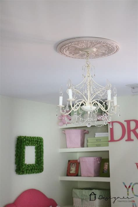 Choose a neutral color, such as tan or grey, for the diy ceiling medallion for best classic styling and a subtle but elegant final appearance. DIY Ceiling Medallion to Hide a Ceiling Flaw | Designertrapped.com