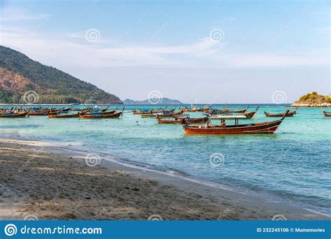 Wooden Long Tail Boat Anchored On The Beach In Tropical Sea At Koh Lipe