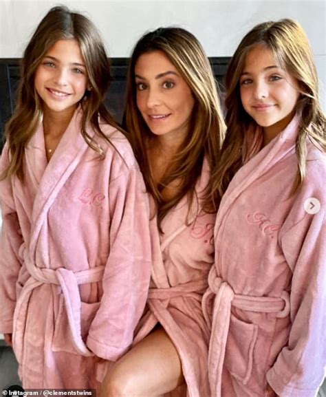 mother poses with lookalike twins who were hailed as the most beautiful girls in the world