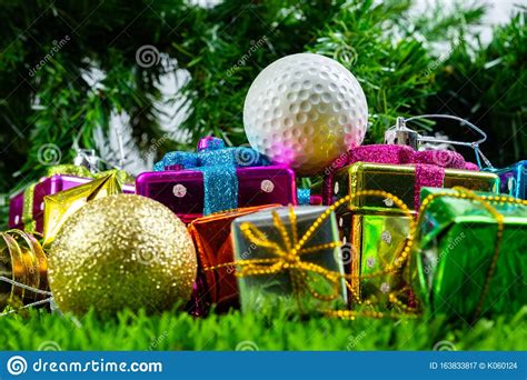 Most major brand name golf balls available. Christmas Gift Box And Golf Ball On Grass Stock Image ...