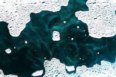 Free Photo Swirls Of Paint And White Foam On Water