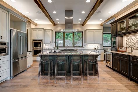 Waynesville Mountain Modern Craftsman House / ACM Design Wood flooring and wood cabinetry.
