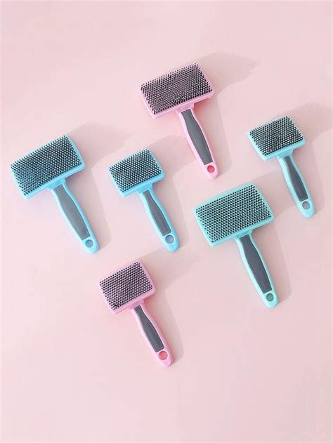 Four Combs With Different Colors On Them Sitting Next To Each Other In