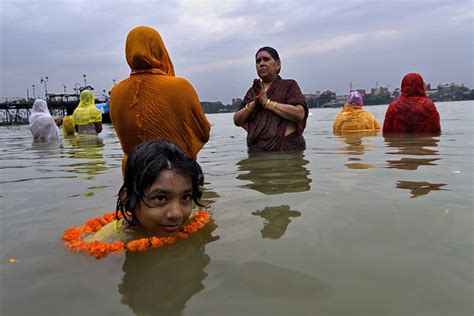 A Young Girl Enjoying Bath At River In The Eve Of Chhatt Puja At