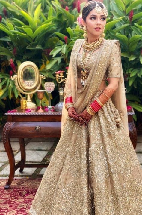Pin By Srishti Kundra On Blushing Brides Golden Bridal Lehenga