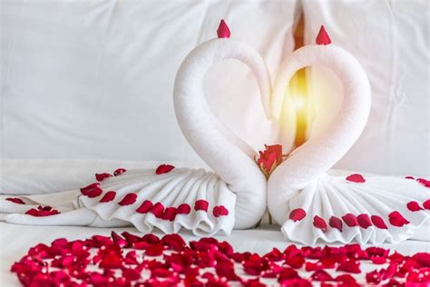 Premium Photo Swan Couple Put On Honeymoon Bed In Heart Shape With