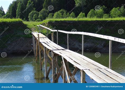 Small Wooden Pedestrian Bridge Across The River Stock Photo Image Of