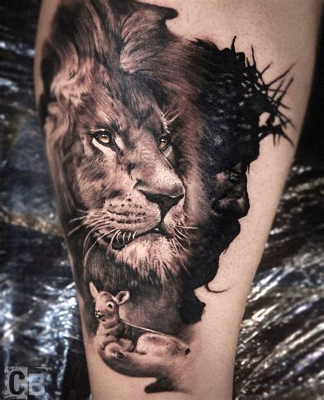 A Black And White Tattoo With A Lion On Its Leg Holding A Mouse