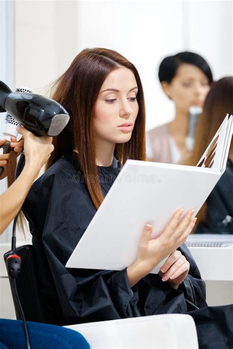 Beautician Does Hair Style For Woman In Hairdressing Salon Stock Image