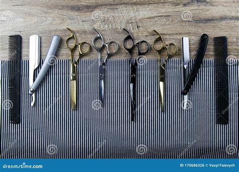 A Set Of Scissors For Haircuts Combs And A Dangerous Razor Spread On A
