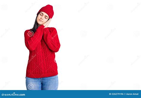 Young Beautiful Girl Wearing Sweater And Wool Cap Sleeping Tired