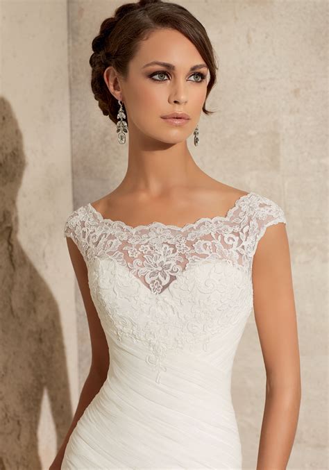 Its layered design adds volume to the silhouette for a unique look. Lace on Net Wedding Dress | Style 5305 | Morilee