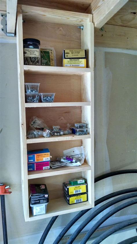 Who here buys what they need for diy projects and then lets them sit for years? Garage storage solution, a fold down/ up shelf that folds into the rafters. #diysheds | Garage ...