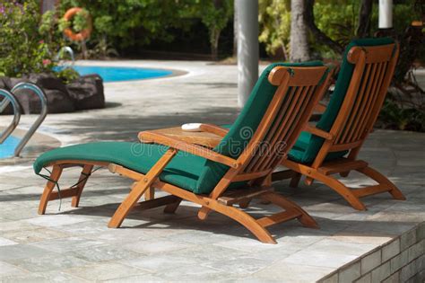 Pool side lounge chairs is one of the best options for you all. Poolside Lounge Chairs Royalty Free Stock Photo - Image ...