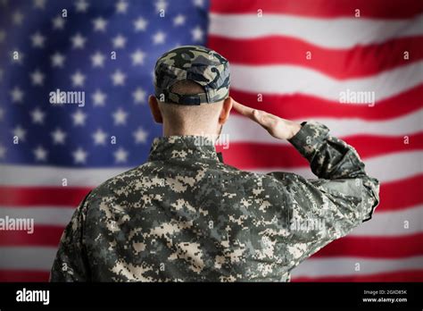 Military Us Soldier Saluting Flag Army Veteran Stock Photo Alamy