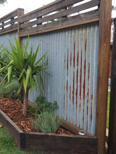 And when using corrugated metal panels to build your fence… Image result for CORRUGATED IRON FENCE SHELF DISPLAYS ...