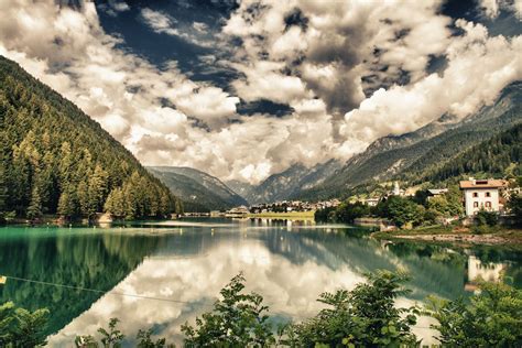 A Reflective Lake In The Italian Alps Travel Places To Visit