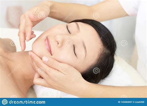Beautiful Young Woman Receiving Facial Massage Stock Image Image Of Closed Hair 143462657
