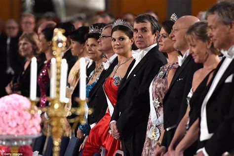 Crown Princess Victoria Of Sweden Centre Gazes Along A Row Of Guests