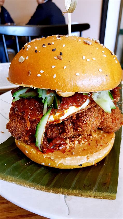 Mcdonald's malaysia chief marketing officer, melati abdul hai, officiating the nasi lemak burger launch. WORLD FOOD PARADISE: Nasi Lemak Burger