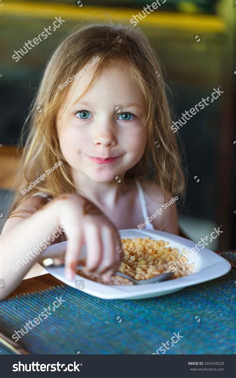 Adorable Little Girl Eating Cereal Milk Stock Photo 245434528