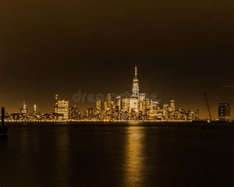 Night Time View Of Lower New York City With Reflections On The Hudson
