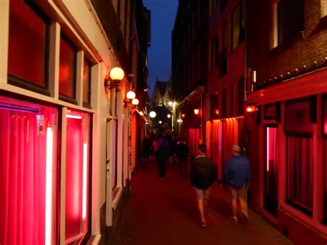 A Street Scene In The Famous Red Light District Of Amsterdam The